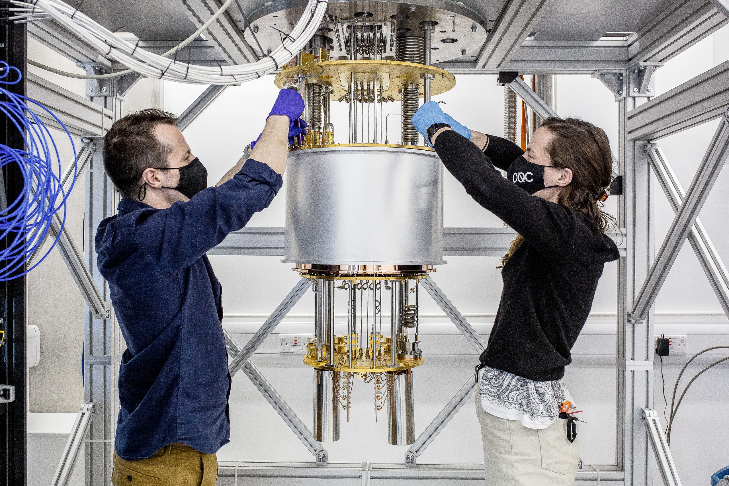 Deployment of OQC's 8 qubits processor Lucy by two quantum engineers. (c) Oxford Quantum Circuits